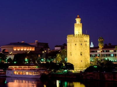 The Torre del Oro and river Guadalquivir at night 
