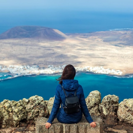 Woman admiring the scenery from the Mirador del Río viewing point. Lanzarote