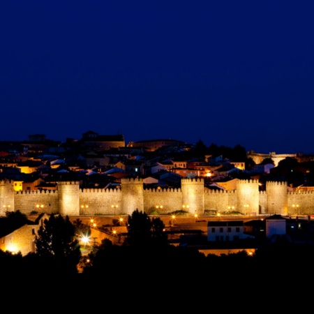 Avila city walls by night