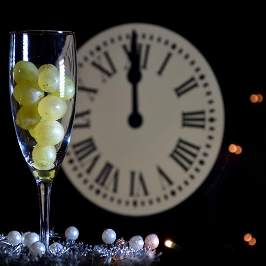 Glass with twelve grapes on New Year's Eve