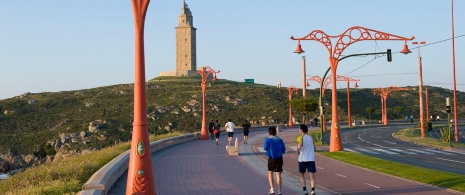 People running and walking along the seafront promenade, A Coruña