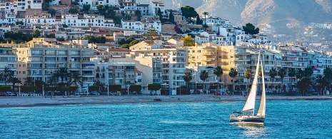 Views of a sailing boat on the coast of Altea in Alicante, Region of Valencia, Spain.