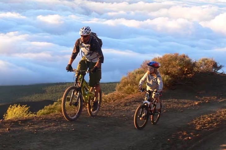 Father and daughter on bicycle Father and daughter on bicycle