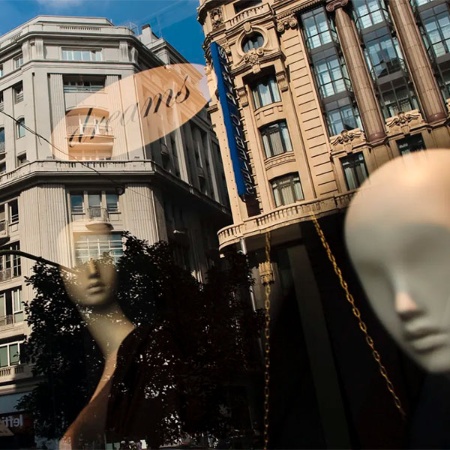 Reflection in the window of a luxury shop in Madrid