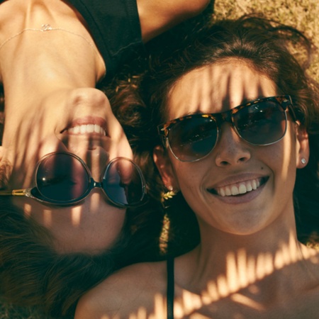 A group of happy girls sunbathing