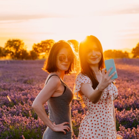 Couple posing in a lavender field at dusk