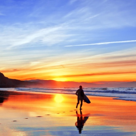 Surfer on the beach in the town of Sopelana, Bizkaia.