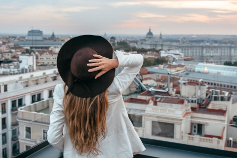 Woman looking at the rooftops in Madrid