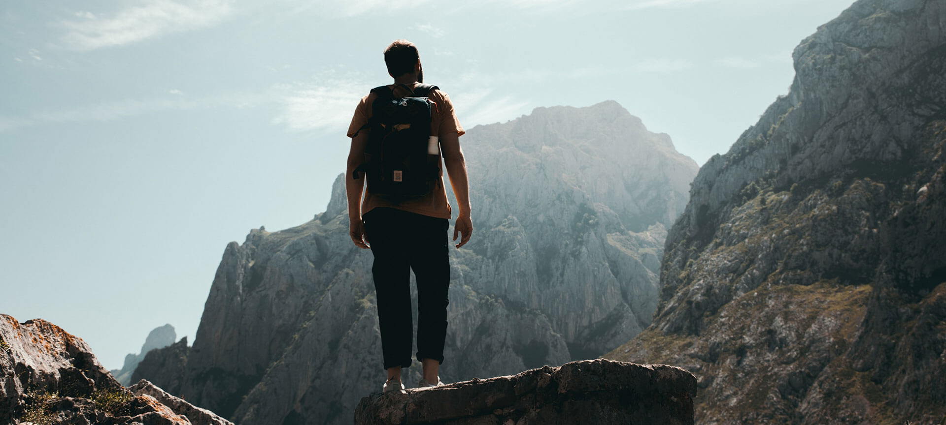 Sports and adventure experiences Man at the top of a mountain.