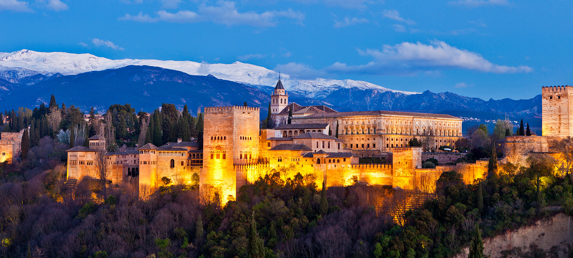 General view of the Alhambra at dawn, in Granada (Andalusia)