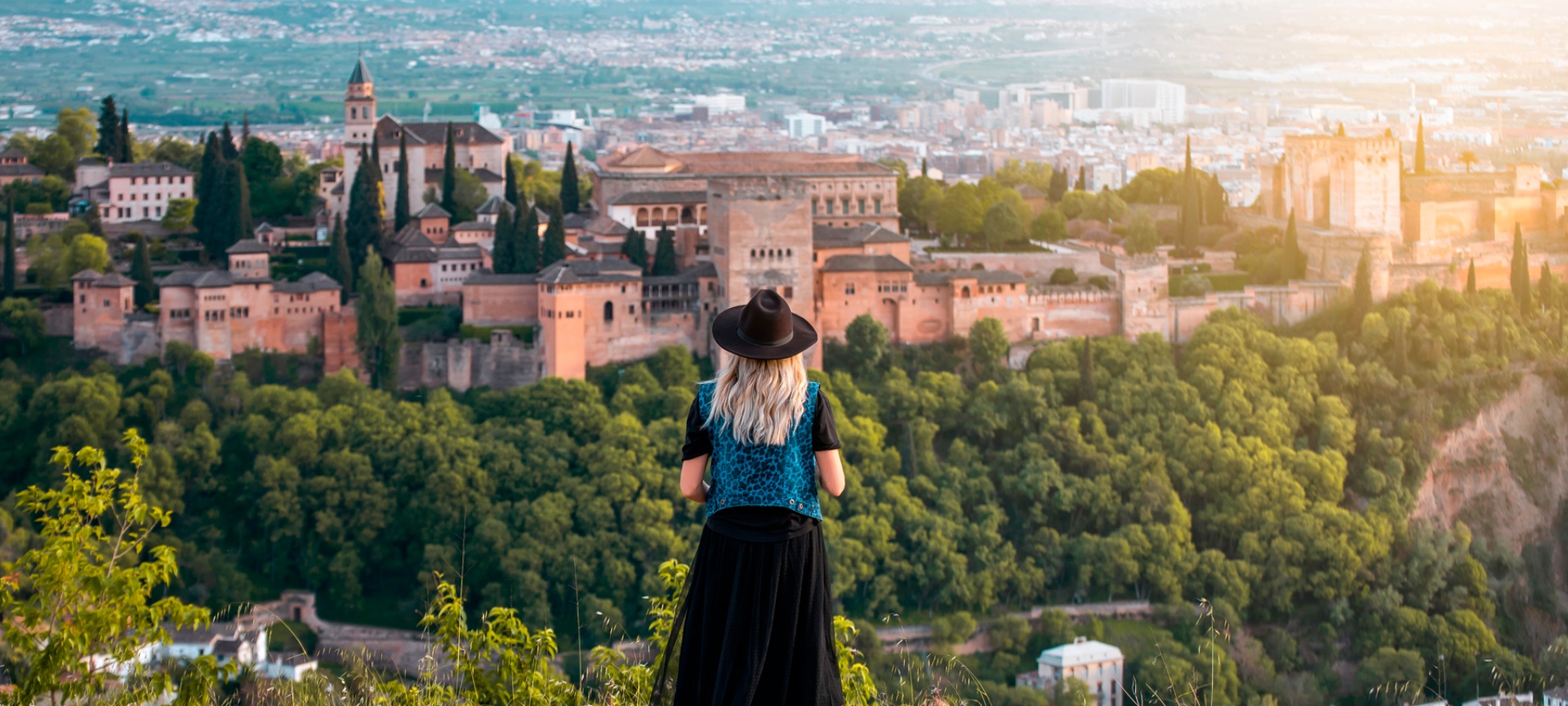 Tourist looking at the Alhambra, Granada, Andalusia Tourist looking at the Alhambra, Granada, Andalusia