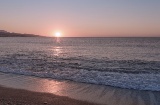 Sunset over a beach in Torre del Mar (Malaga, Andalusia)