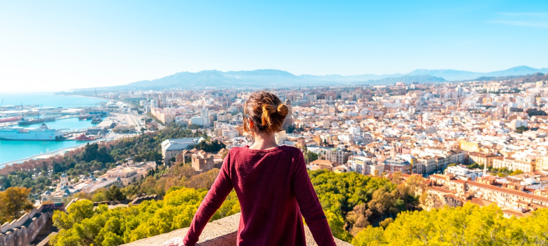 Tourist admiring the city of Malaga from Gibralfaro Castle, Andalusia