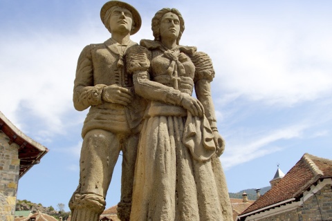 Sculpture of the traditional “chesco” dress in Hecho (Huesca, Aragon)