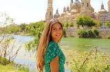 Tourist as the Ebro river goes through the city of Zaragoza, Aragon