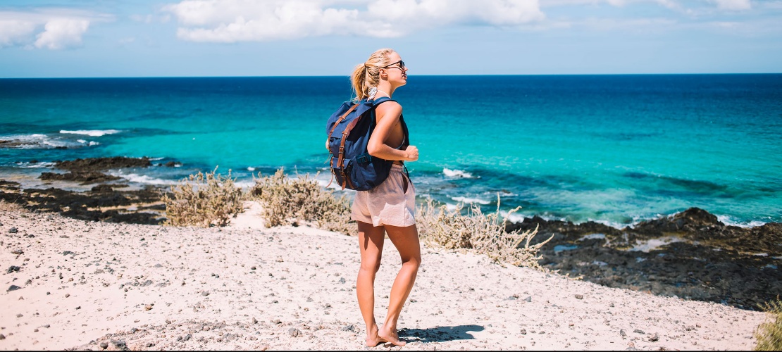 Young woman on a beach in Menorca, Balearic Islands