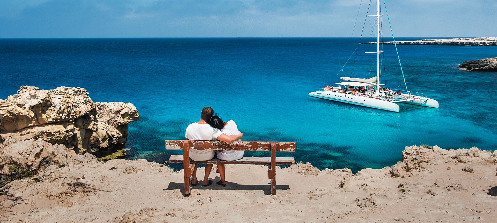 Couple gazing at the sea in the Balearic Islands Couple gazing at the sea in the Balearic Islands