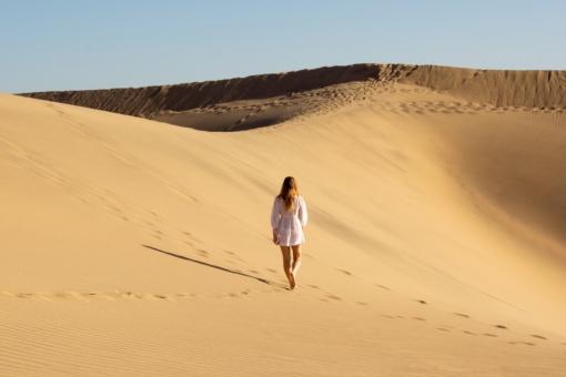 Tourist in the Maspalomas Dunes Special Nature Reserve in Gran Canaria, Canary Islands