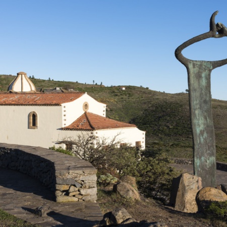 Monument to the whistled language and Church of San Francisco in Chipude (La Gomera, Canary Islands)
