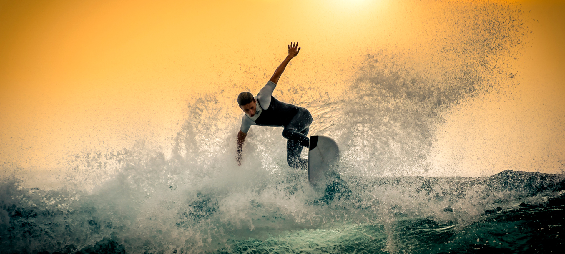 Young man surfing a huge wave in Tenerife, Canary Islands Young man surfing a huge wave in Tenerife, Canary Islands