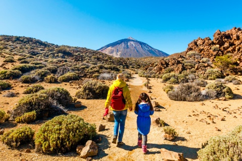 Mother and daughter walking through the Teide National Park, the Canary Islands