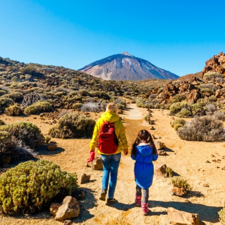 Mother and daughter walking through the Teide National Park, the Canary Islands