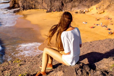 Turista sulla spiaggia del Papagayo, Lanzarote