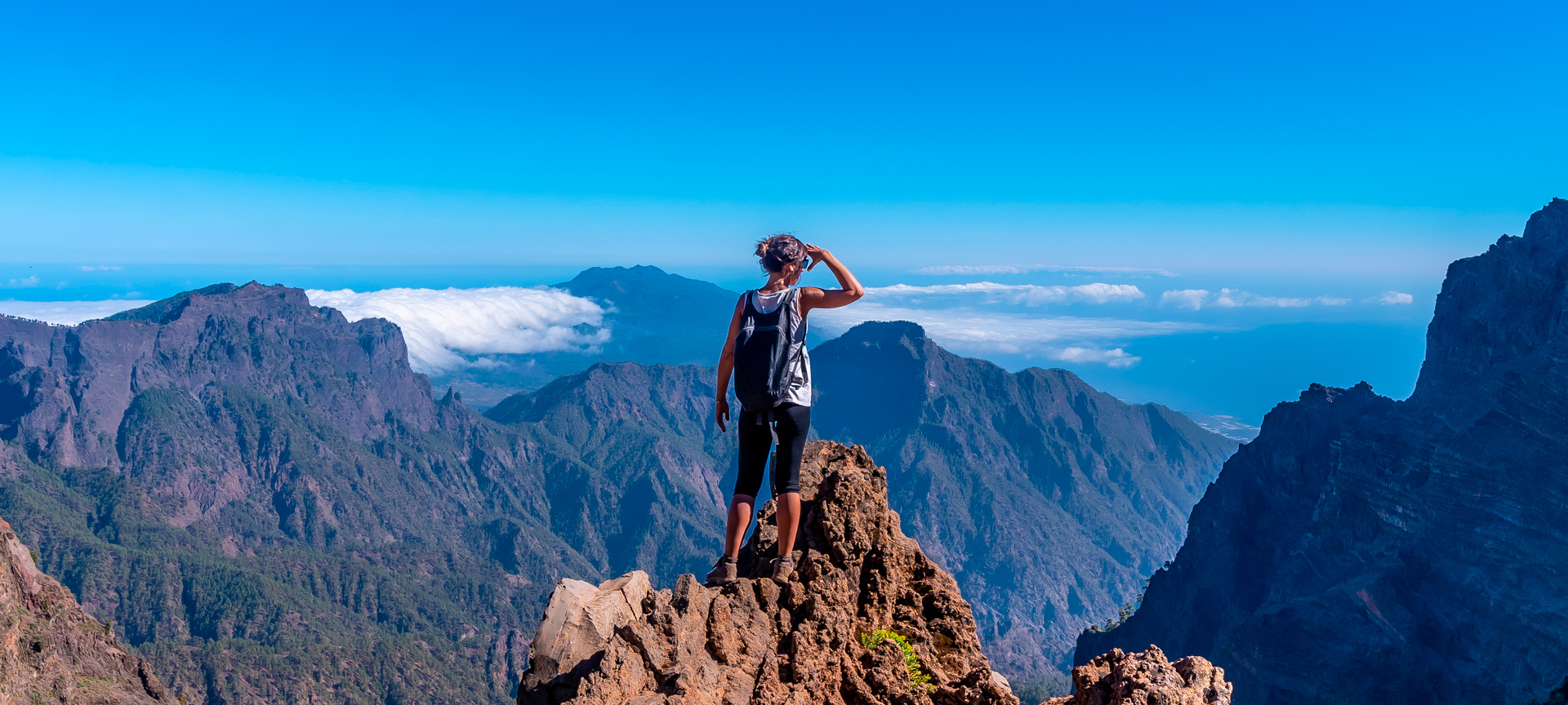 Tourist looking at the view in the Caldera de Taburiente Nature Reserve on La Palma, Canary Islands