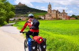 Pilgrim on a bicycle arriving in Castrojeriz (Burgos)