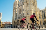 Cyclists in front of Leon Cathedral, Castile and León