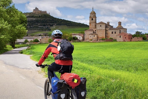 Pilgrim on bicycle on their way through Castrojeriz. Burgos