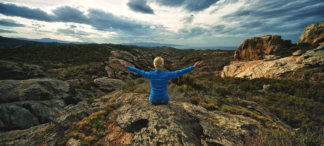 Tourist admiring a rocky landscape in Cap de Creus Natural Park
