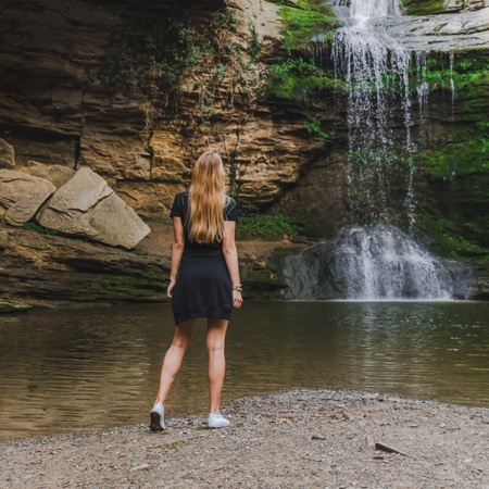 Tourist looking at a waterfall in Rupit, Barcelona