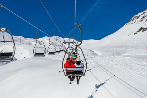 Skiers on a chair lift at the Formigal ski resort