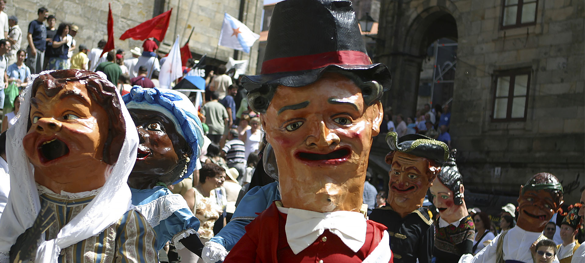 Parade of cabezudos during the Fiestas de la Ascensión
