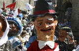 Parade of cabezudos during the Fiestas de la Ascensión