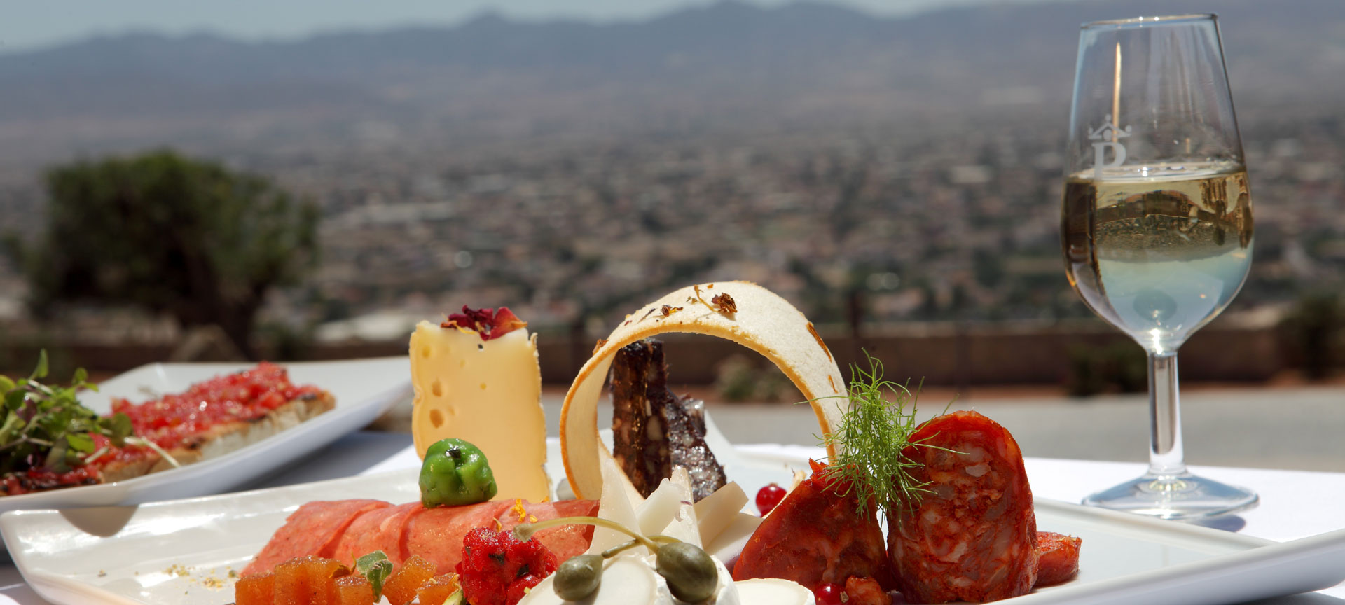 Parador de Lorca with a selection of cured meats and cheeses from the region Parador de Lorca with a selection of cured meats and cheeses from the region
