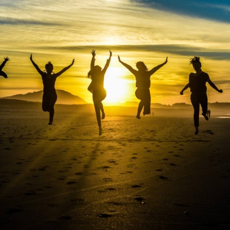 Friends on a beach in Galicia at sunset