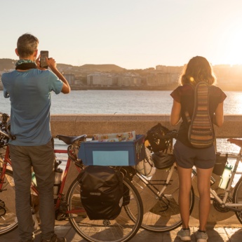 Tourists looking at the sea from the A Coruña promenade, Galicia