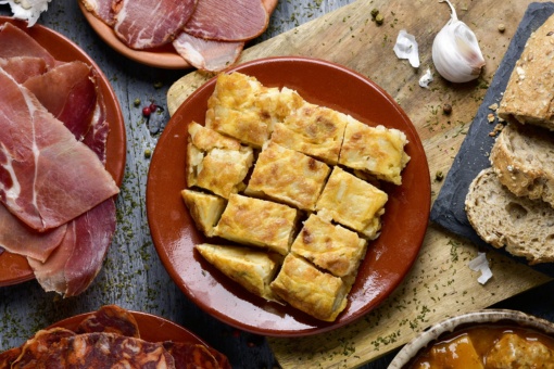Iberian ham and potato omelette: typical dishes in Spanish cuisine.