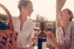 Two women drinking wine