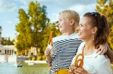 Mother and daughter eating some churros in the Retiro Park in Madrid, Region of Madrid