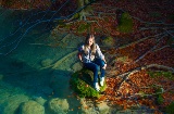 Tourist at the source of the Urederra river in the Urbasa y Andía Natural Park, Navarre