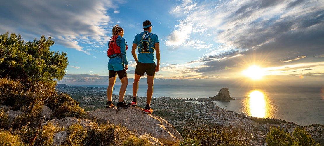 Couple looking at a bird's-eye view of Calpe in Alicante, Valencia, Spain Couple looking at a bird's-eye view of Calpe in Alicante, Valencia, Spain