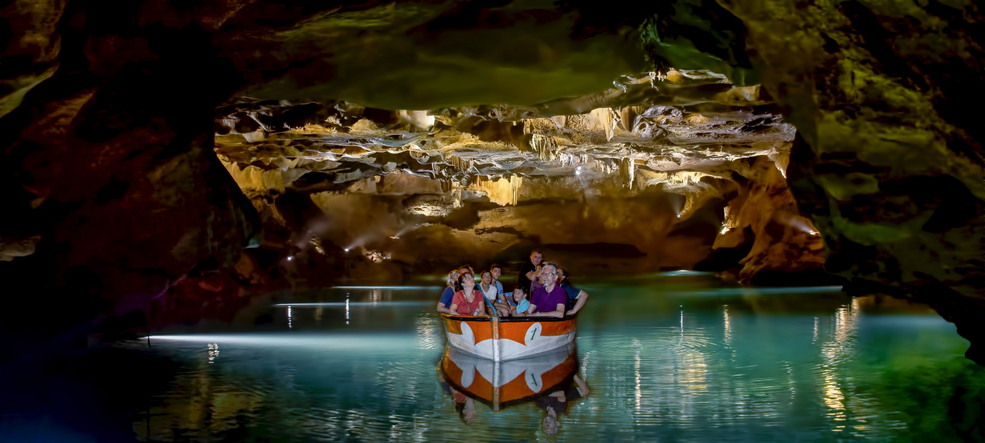 Tourists looking at the Caves of San José de La Vall D