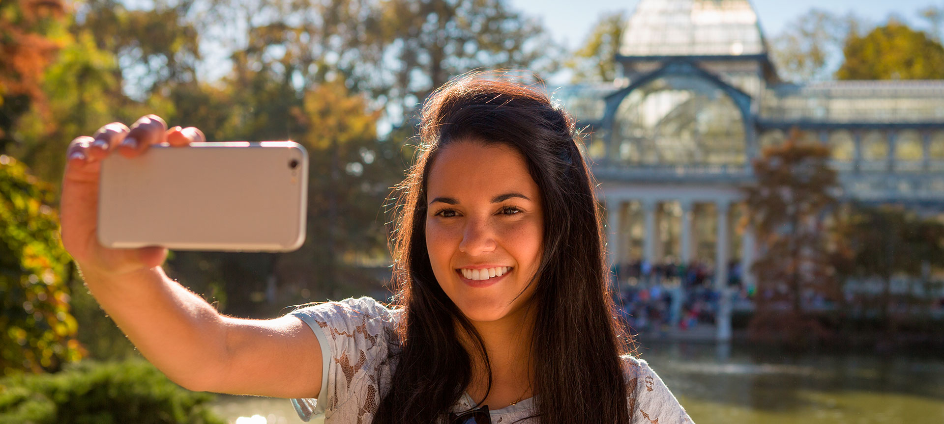 Girl taking a selfie at the Glass Palace in the Buen Retiro Park, Madrid Girl taking a selfie at the Glass Palace in the Buen Retiro Park, Madrid