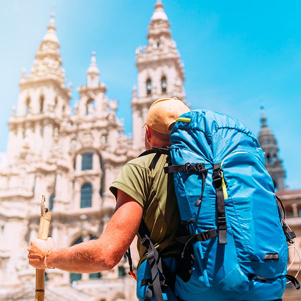 A pilgrim in front of Santiago de Compostela Cathedral