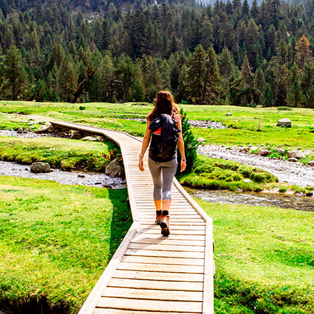 Hiker in the Aigüestortes i Estany de Sant Maurici National Park close to the Circ de Colomers lakes in Lleida, Catalonia