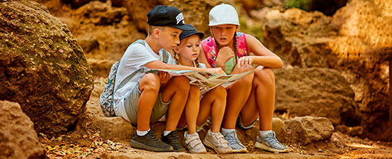 Children studying a map