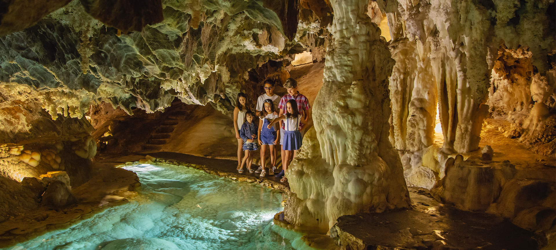 Group of children visiting the Palmatoria, at the Gruta de las Maravillas cave in Aracena. Huelva, Andalusia